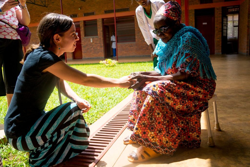 Lianna Mueller ministering to an elder at the Palative Care Hospital Kigali, Rwanda 2016